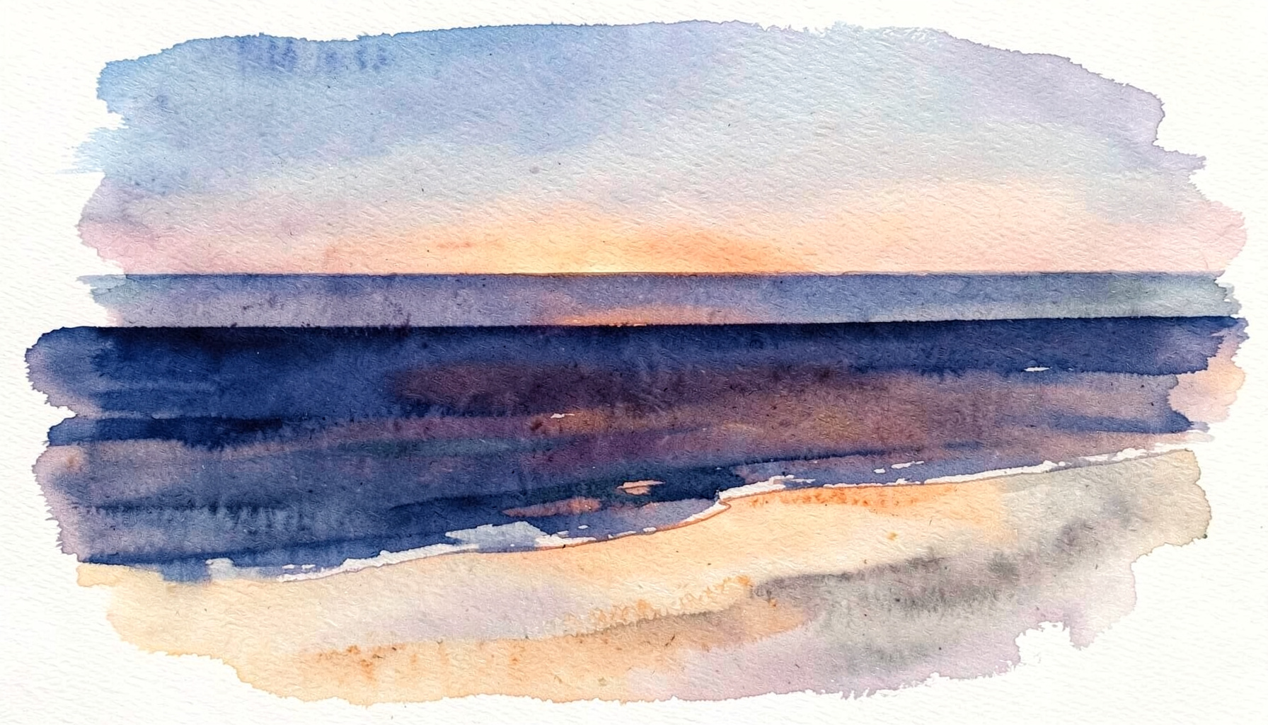 A quiet coastal shoreline at dusk with deep indigo water meeting pale sandy tones under a soft golden sky